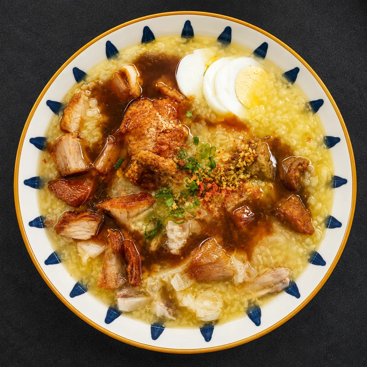 Bowls of goto congee and Filipino noodles at Late Night Go-To in Winnipeg