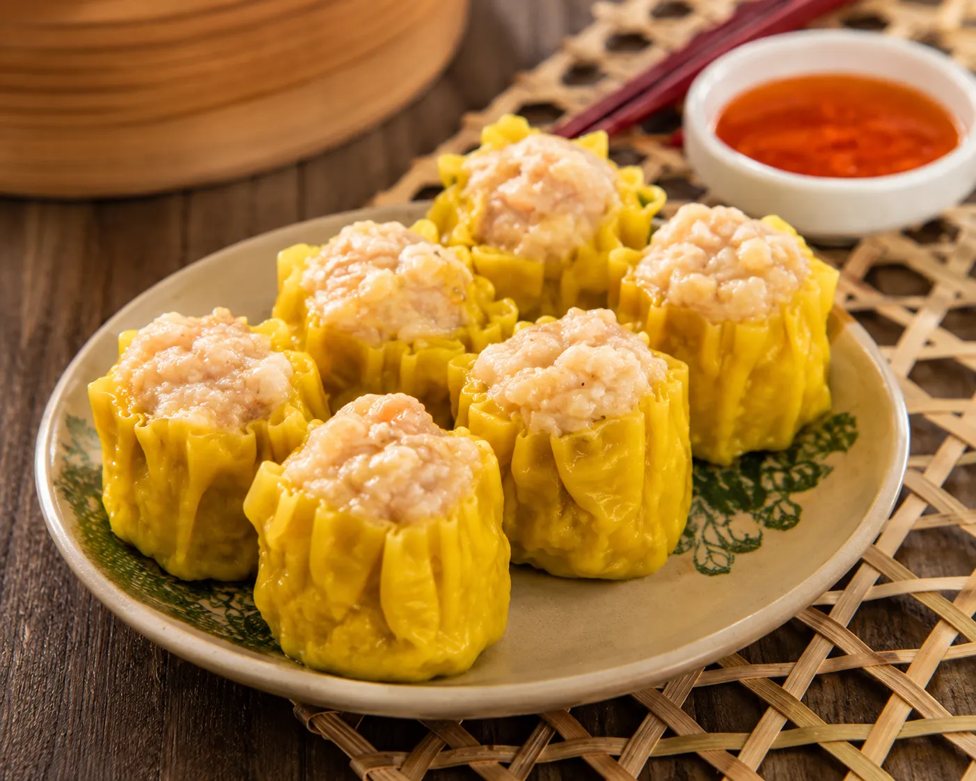 Steamed pork dumplings filled with savory seasoned pork and aromatic herbs.